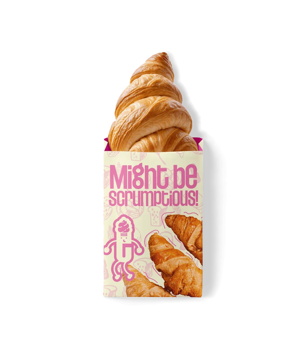The Bakery packaging — a “Might be scrumptious!” pastry bag with a croissant